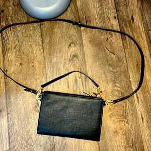 Black over the shoulder strap, removable to be a hand bag, lots of card spaces